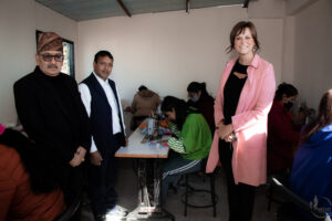 Ambassador viewing new sewing room